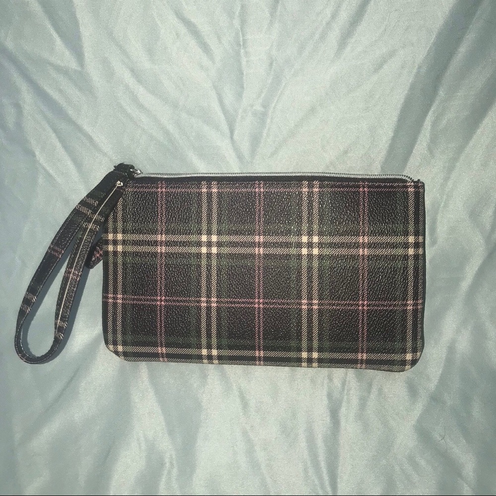 A beautiful green, purple, whitish colored bag